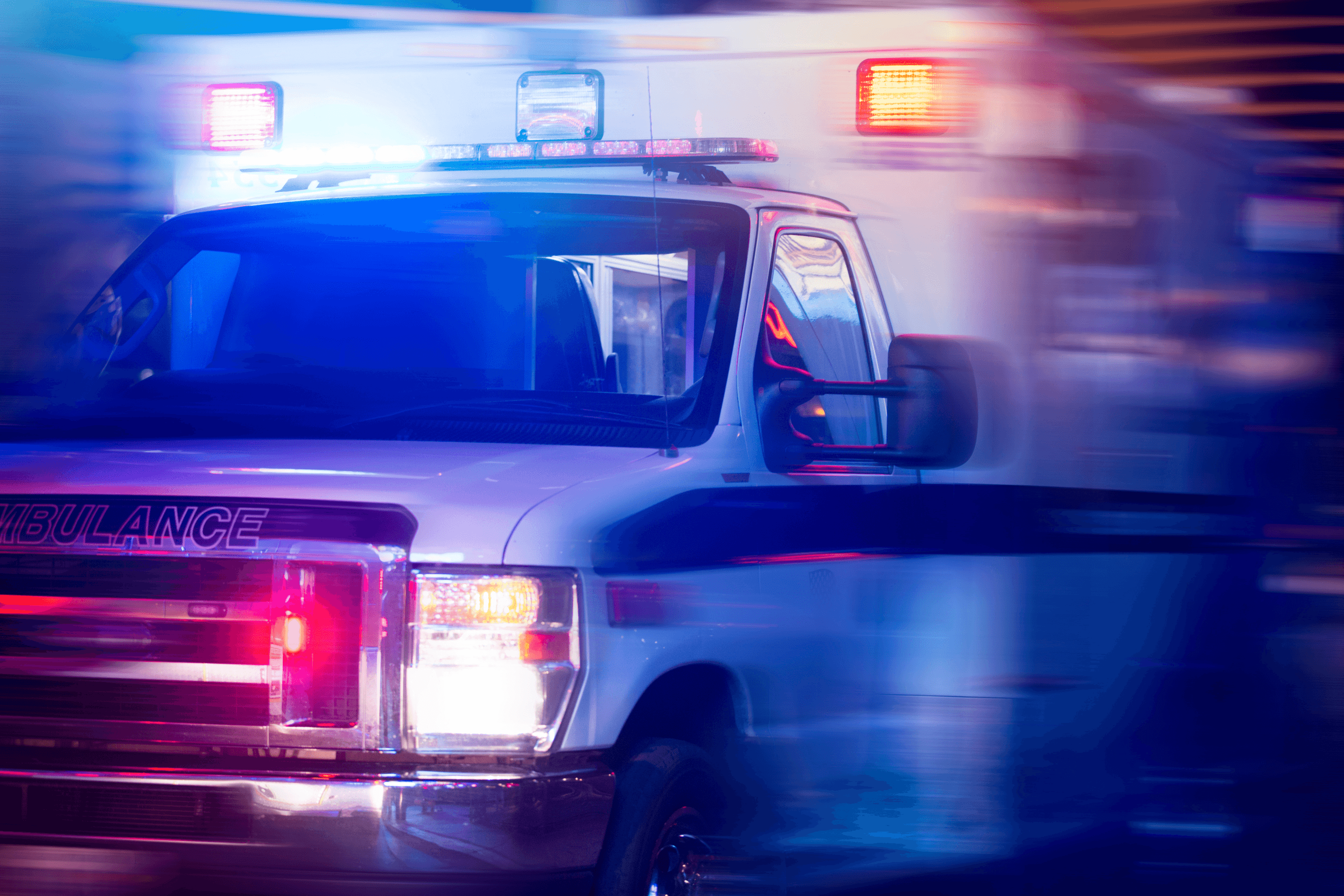 Emergency ambulance with lights at night